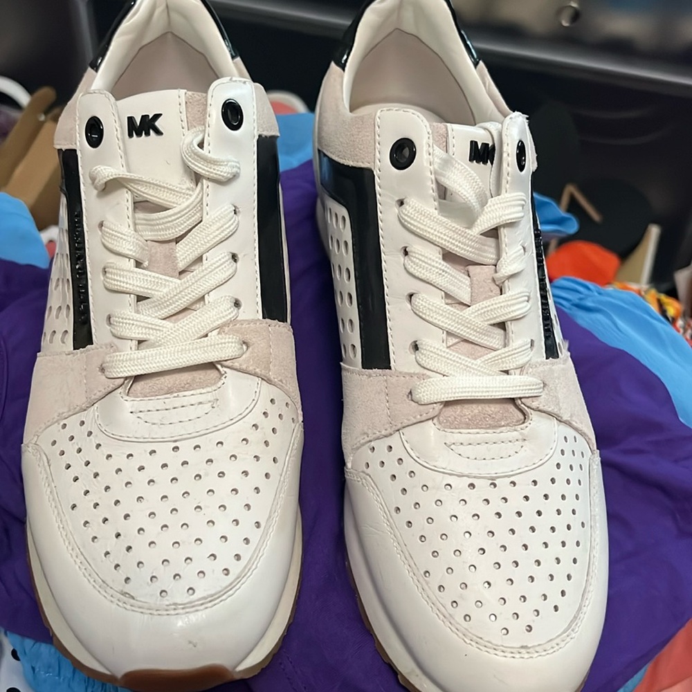 Michael Kors white with black sneakers.